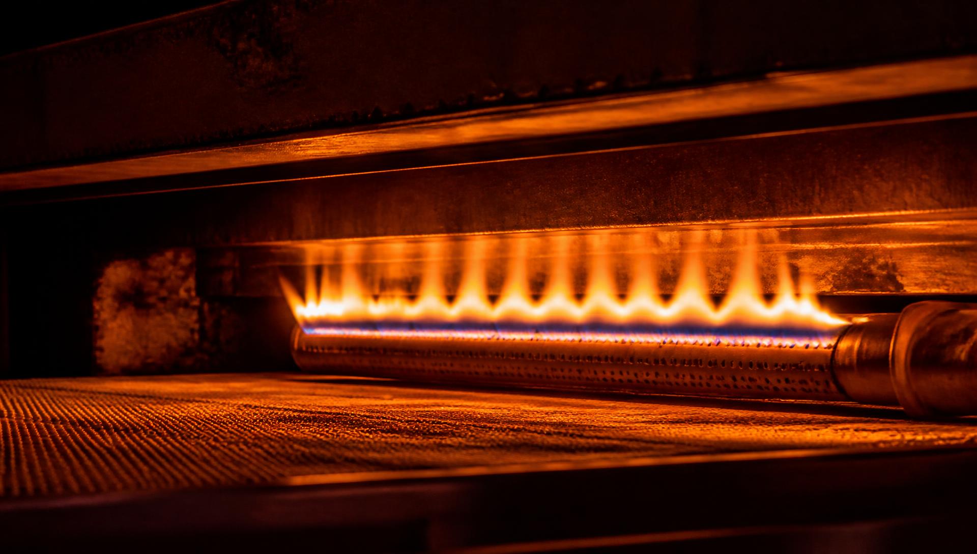 Gas burner flame inside an Agni Sultry curing oven